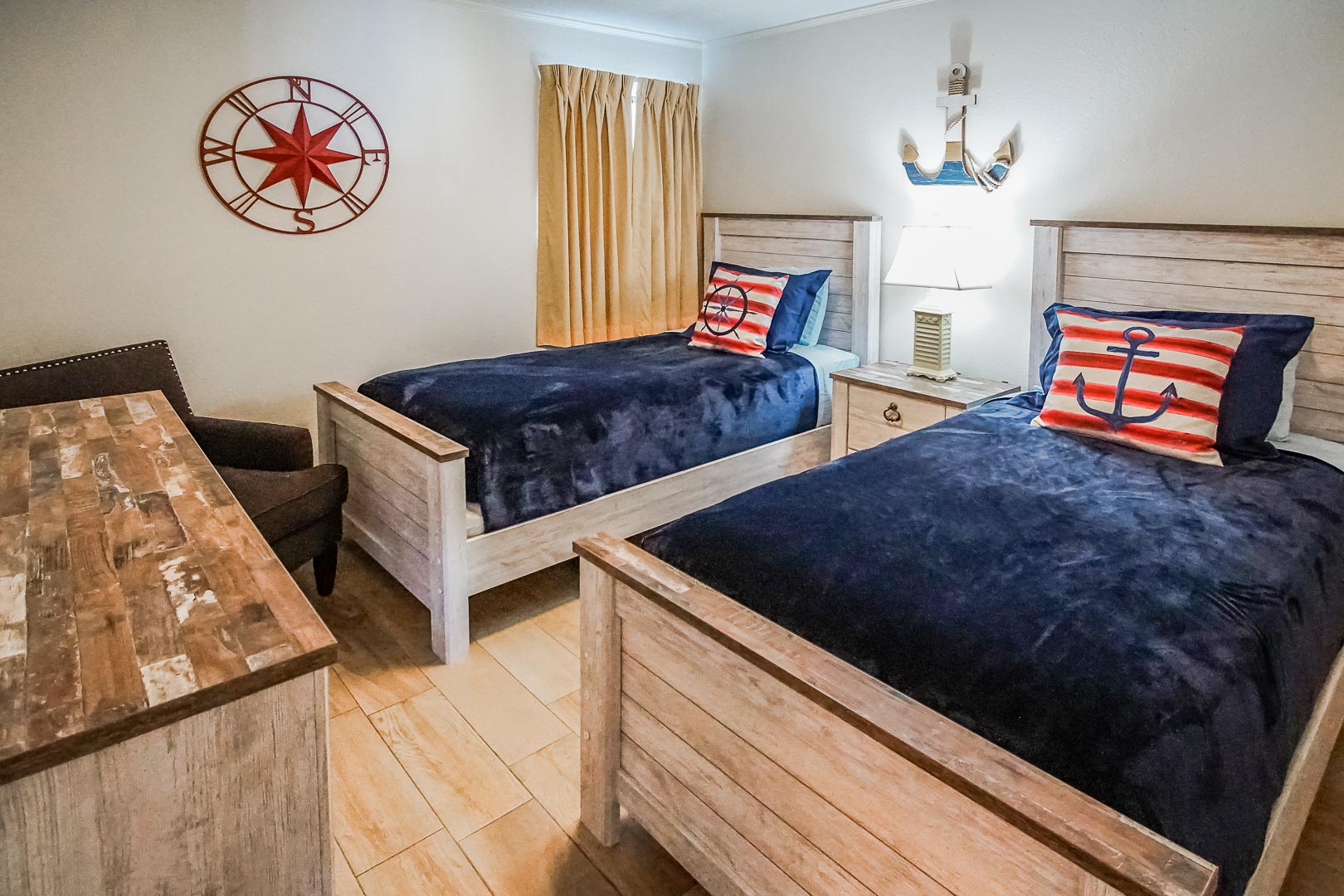 A spacious bedroom with double beds at VRI's Shoreline Towers in Gulf Shores, Alabama.